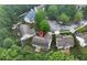 An aerial view of the lovely home nestled in a lush, green neighborhood on an overcast day at 3265 Watson Gate Rd, Loganville, GA 30052