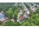An aerial view shows a lovely home in a beautiful, verdant neighborhood with tree lined streets at 3265 Watson Gate Rd, Loganville, GA 30052