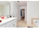 Bright bathroom with a tub and tiled floor at 3265 Watson Gate Rd, Loganville, GA 30052