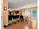 Cozy dining area featuring hardwood flooring, a table with chairs, and access to the backyard at 3265 Watson Gate Rd, Loganville, GA 30052
