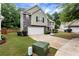 Charming two-story home with a two-car garage, landscaped front yard, and a combination of siding and stone exterior at 3265 Watson Gate Rd, Loganville, GA 30052