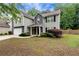 Charming two-story home with a two-car garage, landscaped front yard, and a combination of siding and stone exterior at 3265 Watson Gate Rd, Loganville, GA 30052