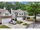 Charming two-story home with a two-car garage, landscaped front yard, and a combination of siding and stone exterior at 3265 Watson Gate Rd, Loganville, GA 30052