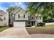 Charming two-story home with a two-car garage, landscaped front yard, and a combination of siding and stone exterior at 3265 Watson Gate Rd, Loganville, GA 30052