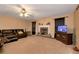 Comfortable living room with a fireplace, ceiling fan, and large windows for natural light at 3265 Watson Gate Rd, Loganville, GA 30052