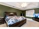 A cozy bedroom with a plush bed and ample natural light from the window at 3265 Watson Gate Rd, Loganville, GA 30052