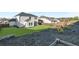 Spacious backyard featuring a pristine lawn, mature trees, and mulched beds at 3560 Summerpoint Xing, Cumming, GA 30028