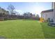 Expansive backyard featuring a lush lawn and mature landscaping, perfect for outdoor activities and entertaining at 3560 Summerpoint Xing, Cumming, GA 30028