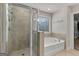 Modern bathroom with a separate shower and soaking tub and natural light at 3560 Summerpoint Xing, Cumming, GA 30028