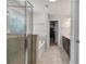 Bathroom with enclosed glass shower, soaking tub and access to walk-in closet at 3560 Summerpoint Xing, Cumming, GA 30028