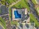 Aerial view of the community pool with a sun deck, covered seating, and parking at 3560 Summerpoint Xing, Cumming, GA 30028
