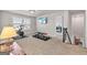 Home gym featuring exercise equipment, dumbbells, mounted television and bright natural light at 3560 Summerpoint Xing, Cumming, GA 30028