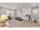 Upstairs gym with weights, Peloton, natural light and stairs to another room at 3560 Summerpoint Xing, Cumming, GA 30028