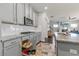 Contemporary kitchen featuring gray cabinets, granite counters, stainless appliances, and an open design at 3560 Summerpoint Xing, Cumming, GA 30028