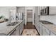 Well-equipped kitchen featuring stainless steel appliances, granite countertops, and plenty of cabinet space at 3560 Summerpoint Xing, Cumming, GA 30028