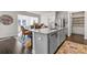 Bright, open kitchen with granite countertops, stainless steel appliances, and a large kitchen island at 3560 Summerpoint Xing, Cumming, GA 30028