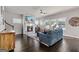 Bright and spacious living room with hardwood floors, fireplace, ceiling fan, and comfortable seating at 3560 Summerpoint Xing, Cumming, GA 30028