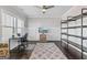 Home office with a large window, modern desk, and hardwood floors at 3560 Summerpoint Xing, Cumming, GA 30028