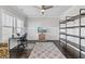 Bright office with a view, with hardwood floors, a large rug and modern shelving at 3560 Summerpoint Xing, Cumming, GA 30028