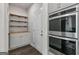 Pantry area with lots of shelving at 3560 Summerpoint Xing, Cumming, GA 30028