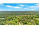 Overhead shot of the property nestled within a dense tree canopy, showcasing its private and wooded setting at 3663 Homewood Trl, Powder Springs, GA 30127