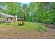 Spacious backyard featuring a wooden playset and swing set, perfect for outdoor Gathering fun at 3663 Homewood Trl, Powder Springs, GA 30127
