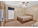 Cozy bedroom with natural light from the window and neutral color palette at 3663 Homewood Trl, Powder Springs, GA 30127
