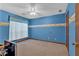 The room features a blue painted wall with a cartoon pattern near the ceiling at 3663 Homewood Trl, Powder Springs, GA 30127