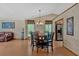 Dining room with a chandelier, hardwood floors, and natural light from the window at 3663 Homewood Trl, Powder Springs, GA 30127