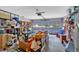 Attached two car garage, floor is cluttered with boxes and storage shelves at 3663 Homewood Trl, Powder Springs, GA 30127