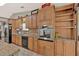 Functional kitchen with stainless steel appliances, ample cabinet space, and tile backsplash at 3663 Homewood Trl, Powder Springs, GA 30127