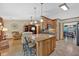 Open kitchen with granite island, pendant lighting, and modern appliances at 3663 Homewood Trl, Powder Springs, GA 30127