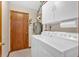 The laundry room has a washing machine, a dryer, and a water heater at 3663 Homewood Trl, Powder Springs, GA 30127