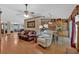 Open-concept living room featuring hardwood floors, a leather sofa, and a cozy recliner at 3663 Homewood Trl, Powder Springs, GA 30127