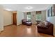 Bright and airy living room with hardwood floors and comfortable seating at 3663 Homewood Trl, Powder Springs, GA 30127