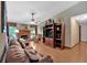 Cozy living room with brick fireplace, built-in shelves, and comfortable seating arrangement at 3663 Homewood Trl, Powder Springs, GA 30127
