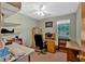 Bright office space featuring built-in shelves, a ceiling fan, and a window offering natural light at 3663 Homewood Trl, Powder Springs, GA 30127