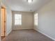 Sun-filled bedroom features plush carpet, neutral colors, and multiple windows at 4417 Roche St, Atlanta, GA 30349