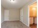 Bedroom offers plush carpet, neutral colors, and an attached bathroom with granite counters at 4417 Roche St, Atlanta, GA 30349