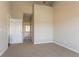 Bedroom with neutral carpet, open door, and lots of light at 4417 Roche St, Atlanta, GA 30349