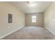 Neutral bedroom features plush carpeting, large window, and a lighted ceiling fan at 4417 Roche St, Atlanta, GA 30349