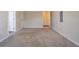 Spacious bedroom features plush carpet, neutral colors, and two entry doors at 4417 Roche St, Atlanta, GA 30349