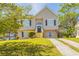 Charming two-story home with a well-maintained lawn and inviting front entrance at 4417 Roche St, Atlanta, GA 30349
