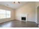 Spacious living room with wood floors, fireplace, and a large window at 4417 Roche St, Atlanta, GA 30349