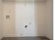 Empty utility room featuring durable vinyl floors and washer dryer hookups at 4417 Roche St, Atlanta, GA 30349