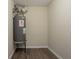 Utility nook features a gray water heater set on a metal stand at 4417 Roche St, Atlanta, GA 30349