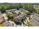 Aerial view of townhomes in a landscaped community with mature trees and well maintained lawns at 11715 Dancliff Trce, Alpharetta, GA 30009
