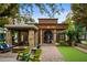 Cafe Intermezzo with inviting outdoor seating areas, a cozy fire pit, and lush landscaping at 11715 Dancliff Trce, Alpharetta, GA 30009