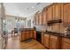 Well-appointed kitchen with wood cabinets, granite countertops, stainless steel appliances, and ample storage at 11715 Dancliff Trce, Alpharetta, GA 30009