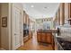 Spacious kitchen with custom cabinetry, granite counters, and modern appliances, ideal for culinary enthusiasts at 11715 Dancliff Trce, Alpharetta, GA 30009